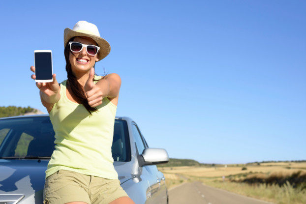 Woman on travel showing phone screen